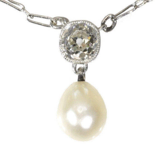 Art Deco platinum love pendant with cushion cut diamond and natural pearl